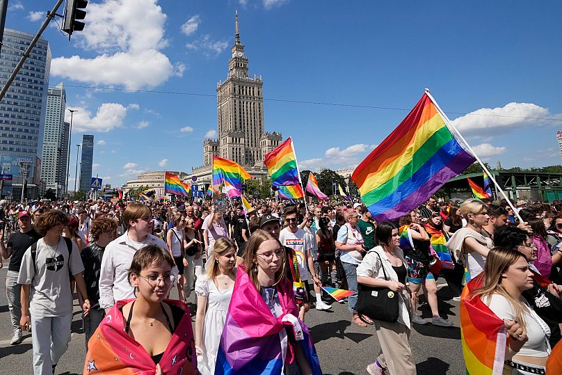 People take part in the Equality Parade, a yearly Pride parade, in Warsaw, 15 June, 2024
