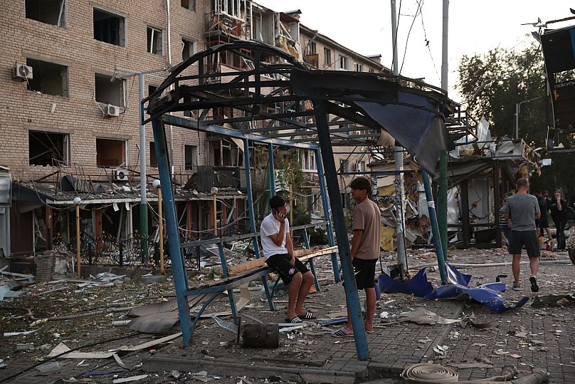 Local residents look at their destroyed home following Russian air strike in Zaporizhzhia, 30 August, 2025