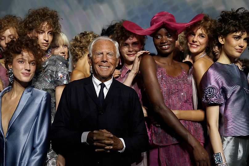 Giorgio Armani, centre, poses with models at the end of his women's 2019 Spring-Summer collection, unveiled during the Fashion Week in Milan - 13 September 2018