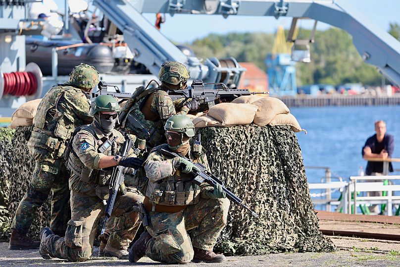 Soldiers of the German forces secure the port at the start of Media Day as part of the Quadriga 2025 military drills in Rostock, 4 September, 2025