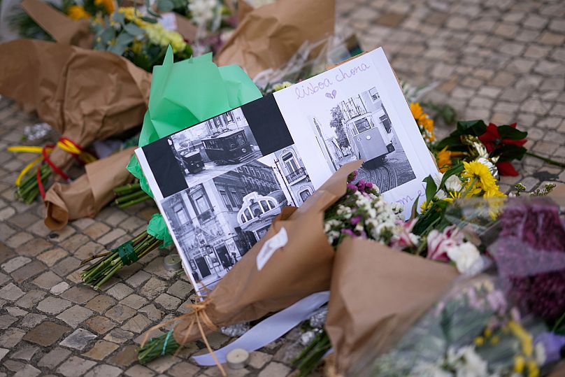 Messages and flowers at the site where a tourist streetcar derailed and crashed in Lisbon, 5 September, 2025