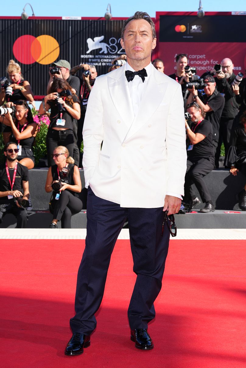 Jude Law looked dapper in a white tuxedo ahead of  ‘The Wizard of the Kremlin’.