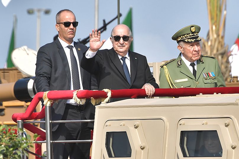 FILE: Algerian President Abdelmajid Tebboune takes part in a military parade to mark the 70th anniversary of Algerian war for independence, in Algiers, 1 November 2024