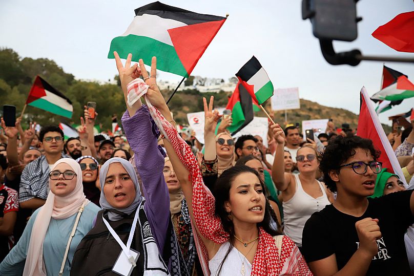 Tunisian people chant in support of the the Global Sumud Flotilla as it arrives at the port of Sidi Bou Saïd, in Tunis, Tunisia, Sunday, Sept. 7, 2025.