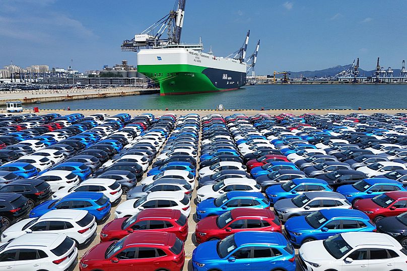 New cars awaiting shipment to foreign markets from a port in Yantai in east China's Shandong province, 21 August, 2025