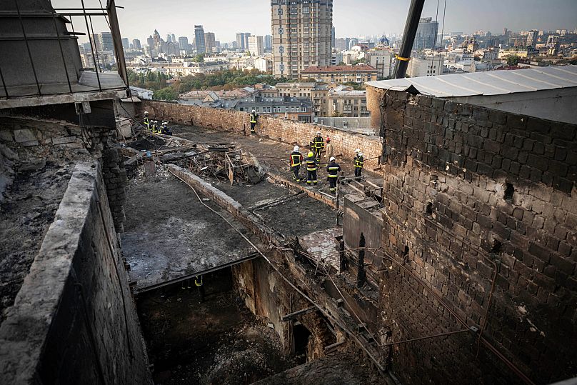 Rescue workers clear the rubble of the Cabinet of Ministers building damaged after a Russian attack in Kyiv, 8 September, 2025