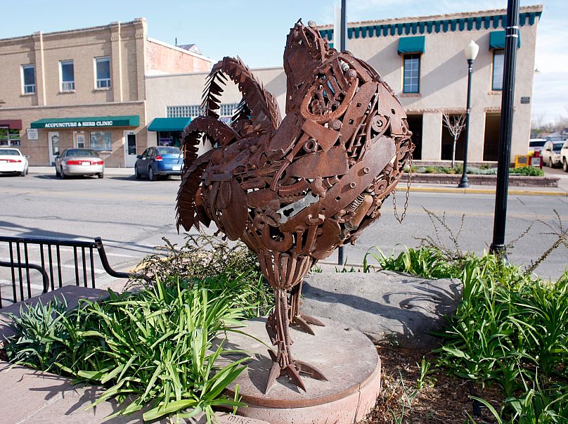 The sculpture of Miracle Mike, the headless chicken stands along the main street in Fruita, Colorado