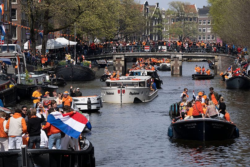 Orange-clad people celebrate King's Day in Amsterdam, Netherlands, Thursday, 27 April 2023.