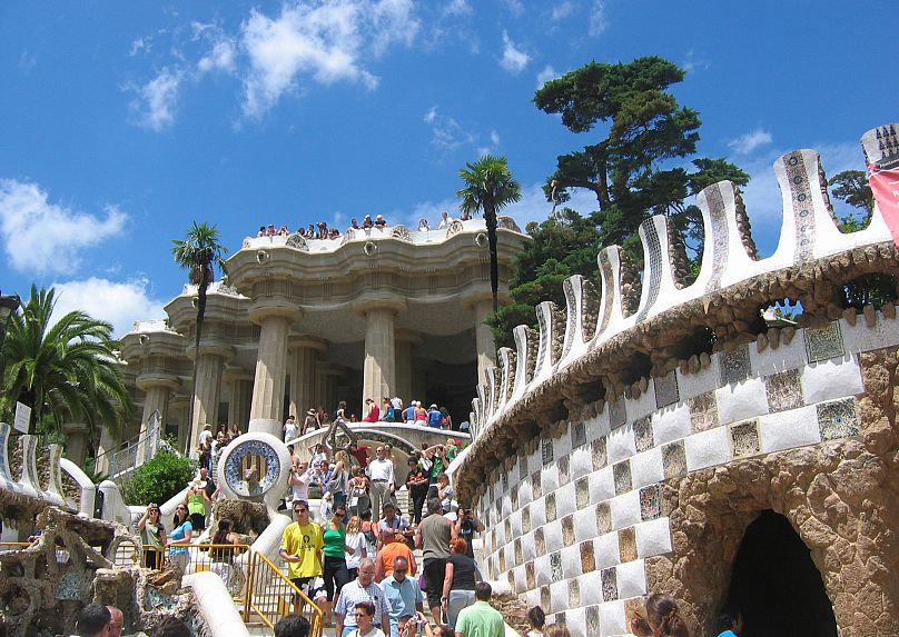 Visitors stroll around Park Guell in Barcelona, Spain.