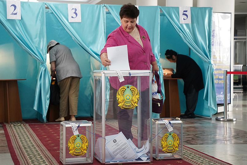 FILE: A woman casts her ballot at a polling station during the Nationwide Referendum in Astana, 5 June 2022