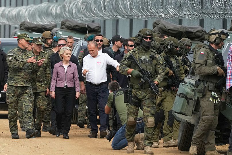 Polish Prime Minister Donald Tusk and European Commission President Ursula von der Leyen walk during their visit to the Polish-Belarus border, in Krynki, 31 August 2025