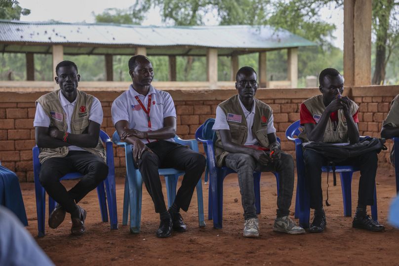 Aid workers with an international aid group in the Maban Office sit in Doro Refugee Camp Community Centre, Maban, South Sudan, Aug 19, 2025.