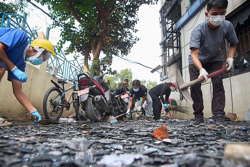 Volunteers from Maitry Nepal clean police station which was vandalized during anti-corruption protests in Kathmandu, Nepal, Saturday, Sept. 13, 2025.