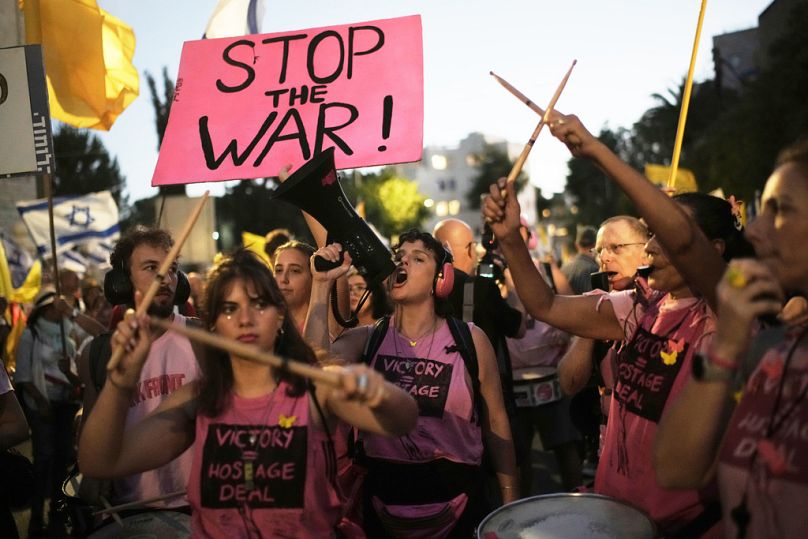FILE - People take part in a protest demanding the immediate release of all hostages held by Hamas and calling for the end to the war in Gaza, in Jerusalem, Wednesday, Sept. 3
