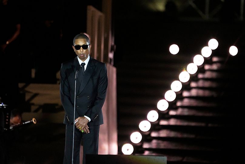 Pharrell Williams speaks during a concert in St. Peter's Square for the conclusion of the World Meeting on Human Fraternity at the Vatican, Saturday, Sept. 13, 2025. 