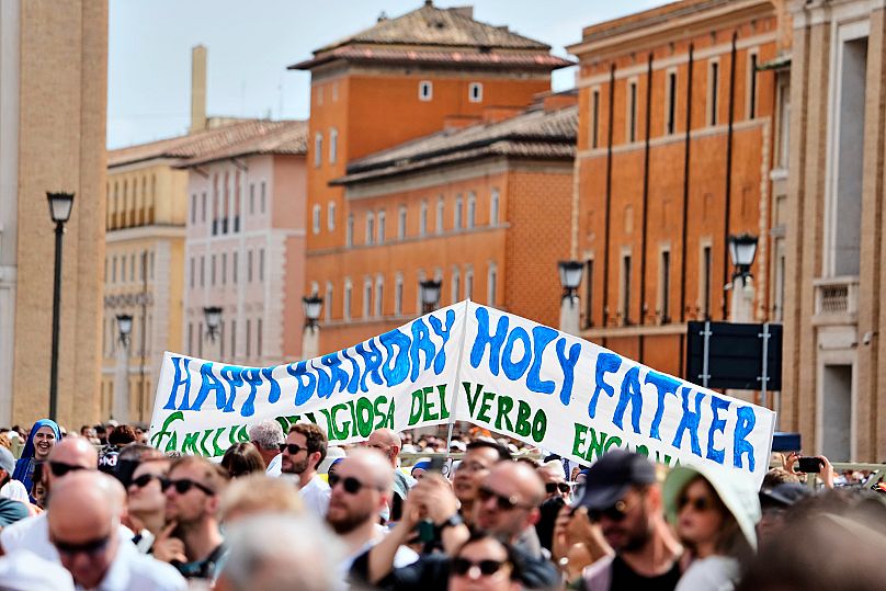 Faithful display a banner wishing happy 70th birthday to Pope Leo XIV in St Peter's Square at the Vatican, Sunday, 14 September 2025.