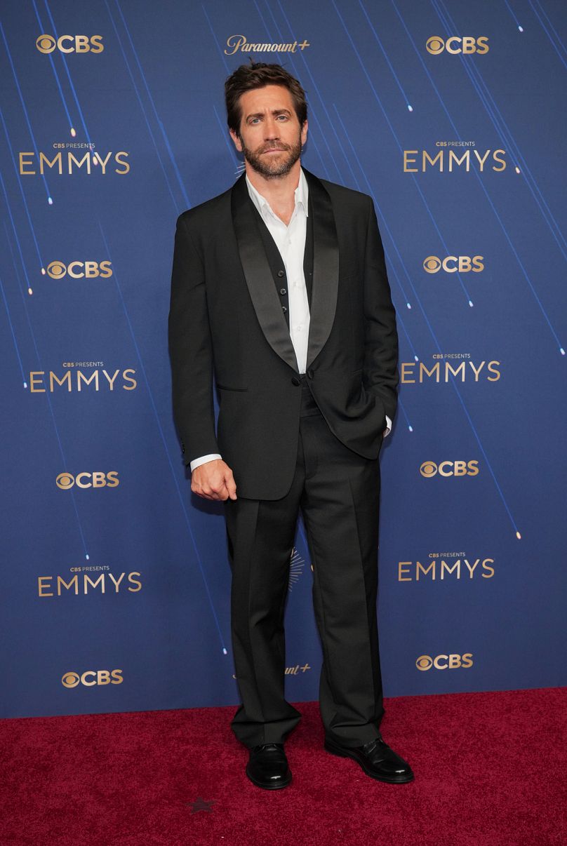 Jake Gyllenhaal kept it relaxed in a Prada suit with his shirt and waistcoat unbuttoned.