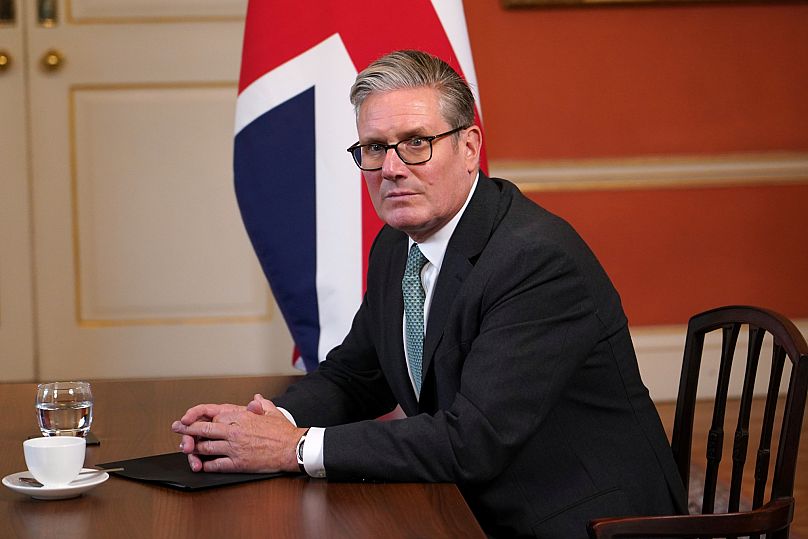 Britain's Prime Minister Keir Starmer sits at a table at10 Downing Street in London, 10 September, 2025