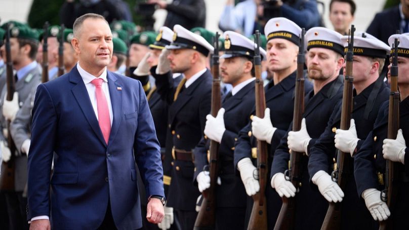 Poland's President Karol Nawrocki walks past military honors in front of Bellevue Palace in Berlin Tuesday, Sept. 16, 2025.