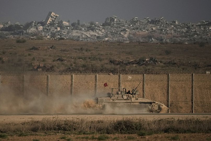 An Israeli armored vehicle moves along the Israeli-Gaza border as seen from southern Israel, Tuesday, Sept. 16, 2025. 