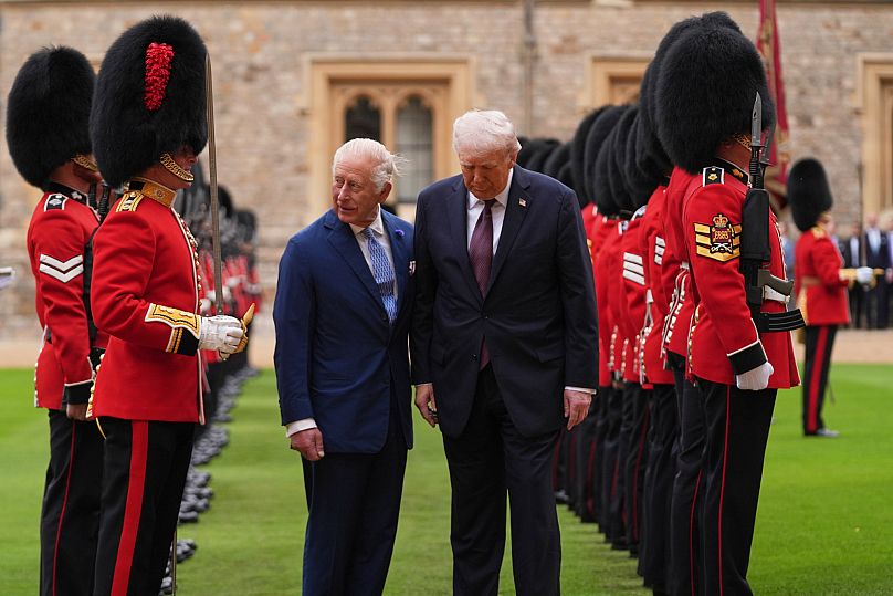 US President Donald Trump and King Charles inspect the guard of honour during an arrival ceremony at Windsor Castle, 17 September, 2025