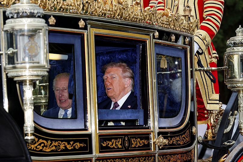 King Charles and US President Donald Trump sit in a carriage during a procession through Windsor Castle, 17 September, 2025