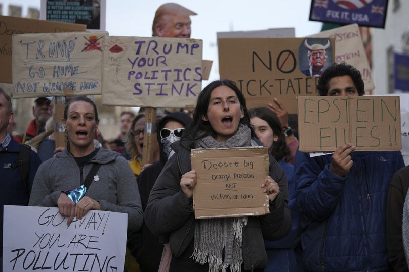 Protesters gather for a demonstration ahead of the arrival of President Donald Trump in Windsor, England, Tuesday, Sept. 16, 2025.(AP Photo/Kin Cheung)