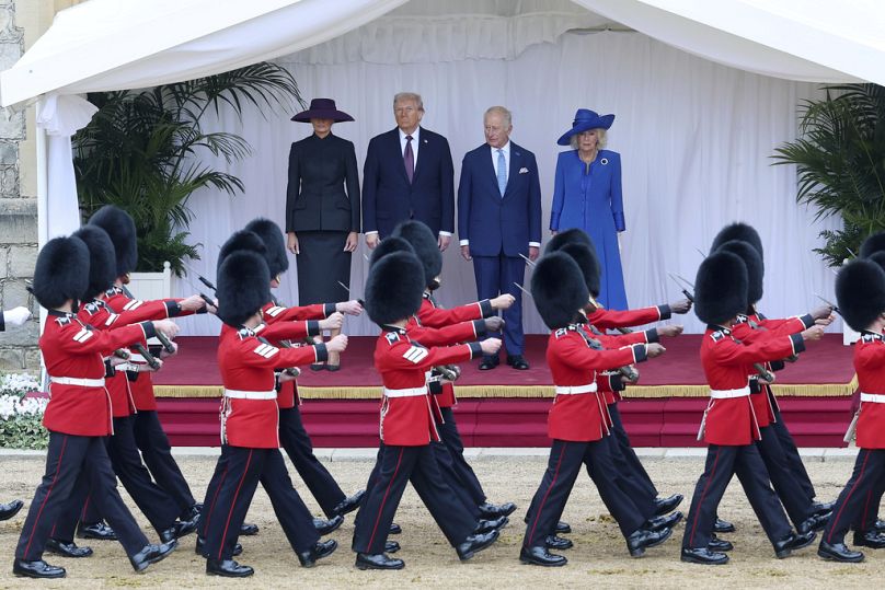 First lady Melania Trump, from left, President Donald Trump, Britain's King Charles III and Queen Camilla review the Guard of Honour at Windsor Castle in Windsor, 17 September