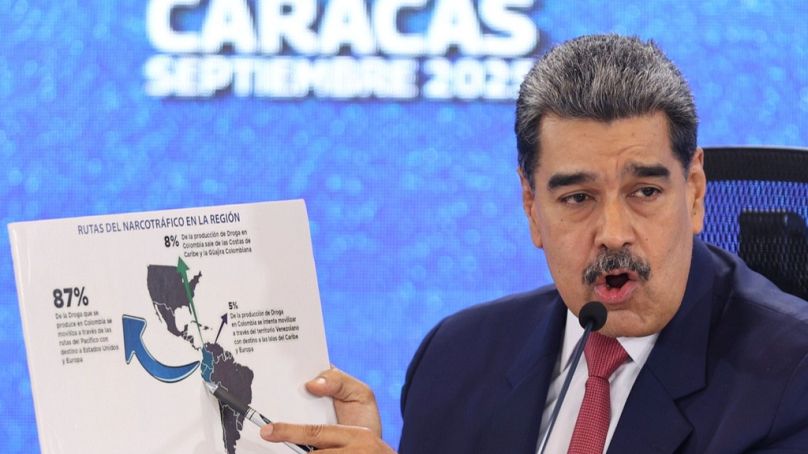 Venezuelan President Nicolas Maduro points at a map of the Americas during a press conference in Caracas, Venezuela, Monday, Sept 15, 2025