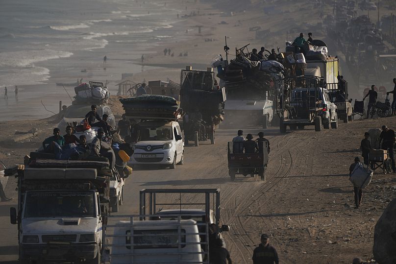 Displaced Palestinians flee Gaza City by foot and vehicles carrying their belongings along the coastal road toward southern Gaza, 17 September, 2025