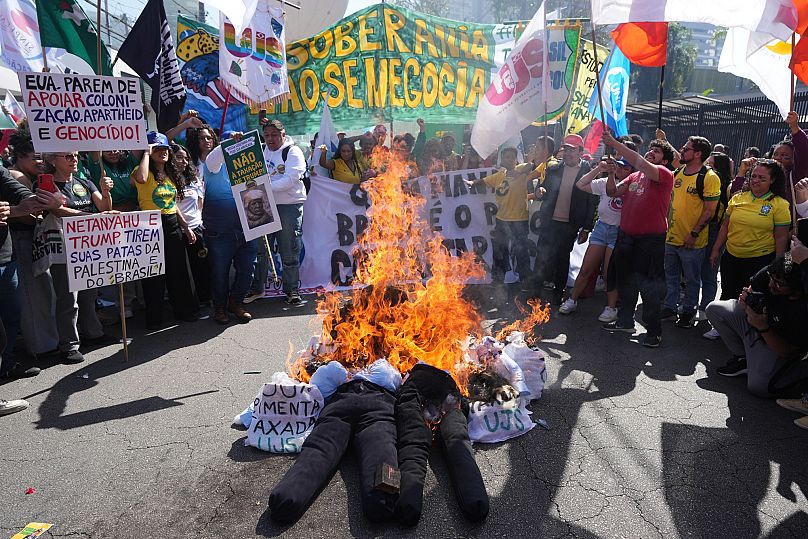 Protesters burn effigies of US President Donald Trump and Brazil's former President Jair Bolsonaro to protest a 50% US tariffs in Sao Paulo, 1 August, 2025