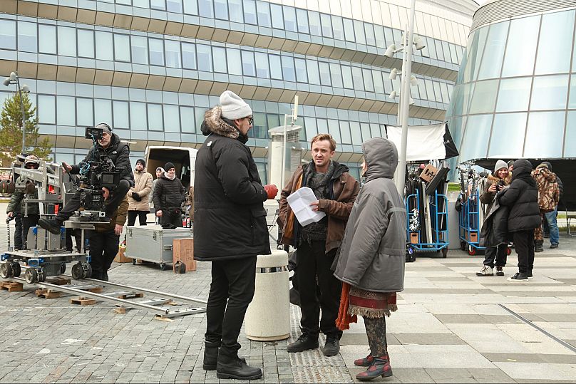 Timo Vuorensola, Tom Felton and Elizaveta Bugulova discuss a scene on the set of Altered