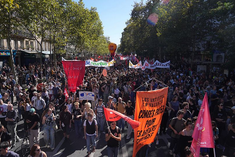 Protesters march during a demonstration called by major trade unions to oppose budget cuts in Paris, 18 September, 2025