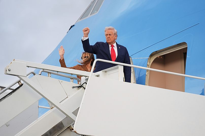 US President Donald Trump and First Lady Melania Trump wave as they board Air Force One at Stansted airport, 18 September, 2025