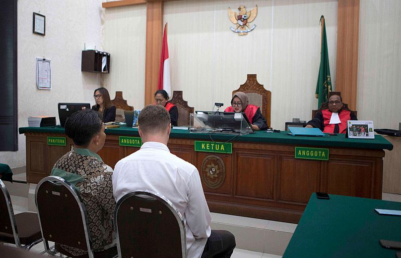 Ukrainian citizen Roman Nazarenko attends a hearing at the district court in Denpasar, 18 September, 2025