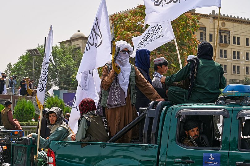Taliban fighters and supporters during celebrations marking the fourth anniversary of the US withdrawal in Kabul, 15 August, 2025
