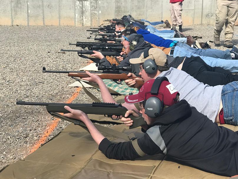 Residents of Orem, including minors, learn how to shoot at one of Michael's classes