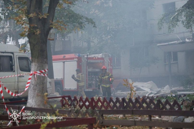 Rescue workers put out a fire of a residential house damaged by a Russian strike on Dnipro, Ukraine, on Saturday, Sept. 20, 2025.. 
