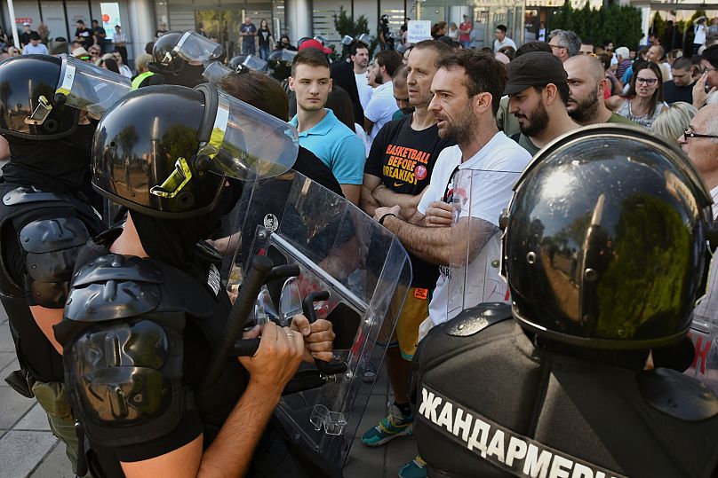 Serbian riot police prevent students and other opposition supporters from attending the military parade in Belgrade, Serbia, Saturday, Sept. 20, 2025., 