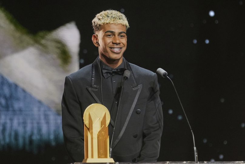 Barcelona's Lamine Yamal receives the Kopa Trophy during the 69th Ballon d'Or (Golden Ball) award ceremony at Theatre du Chatelet in Paris, Monday, Sept. 22, 2025