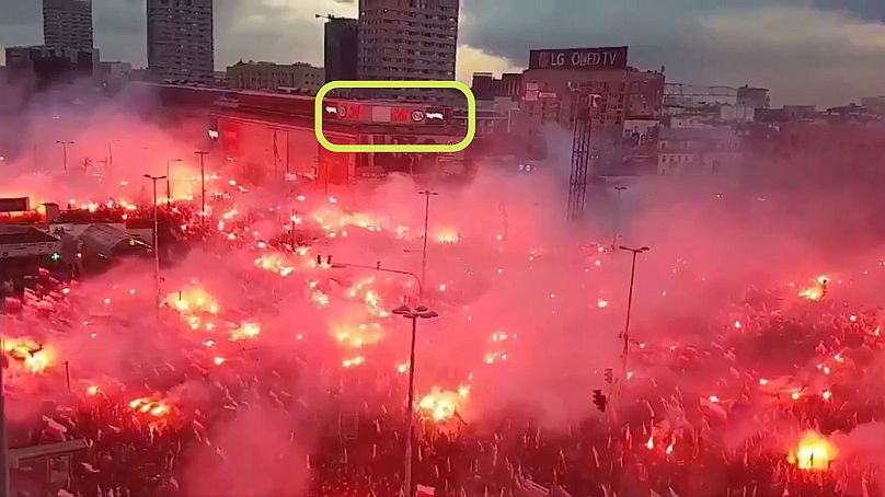 You can see signs for certain retailers in a still from the video