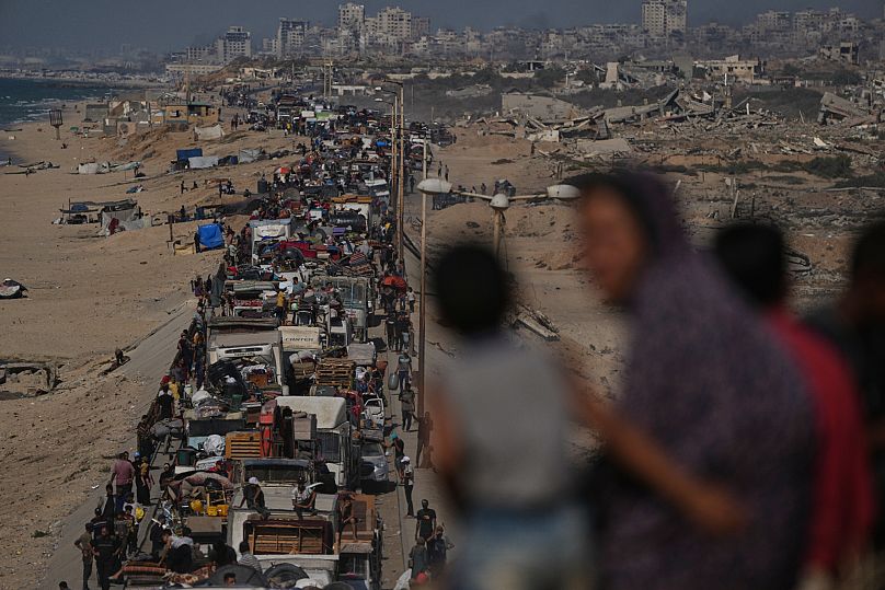 Displaced Palestinians flee northern Gaza Strip along the coastal road near Wadi Gaza, 23 September, 2025