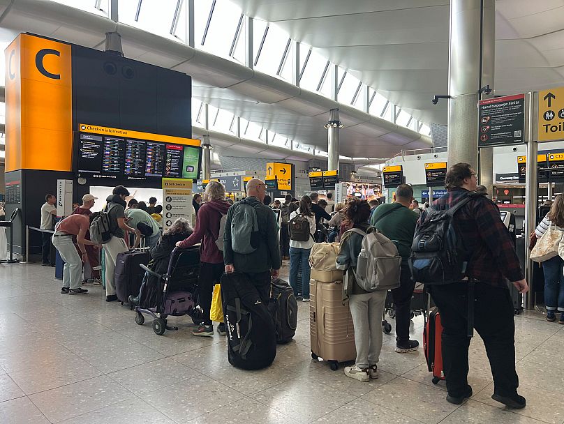 People queuing at Heathrow Airport after flights were delayed and cancelled after an alleged cyberattack, 20 September, 2025