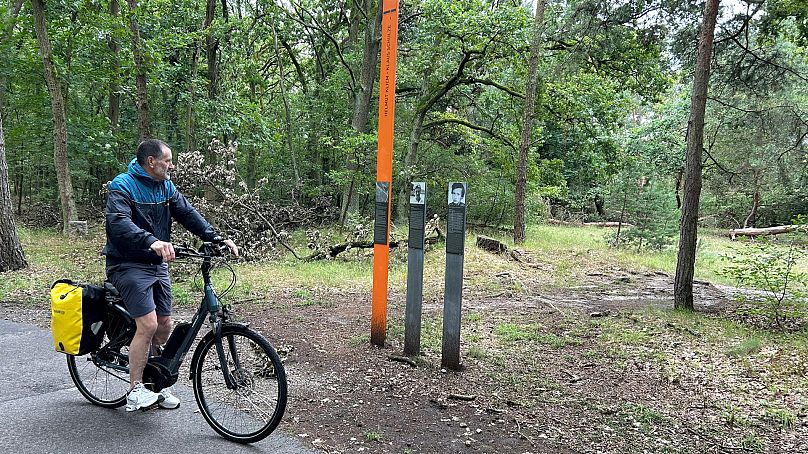 Storytelling steles punctuate the trail. 