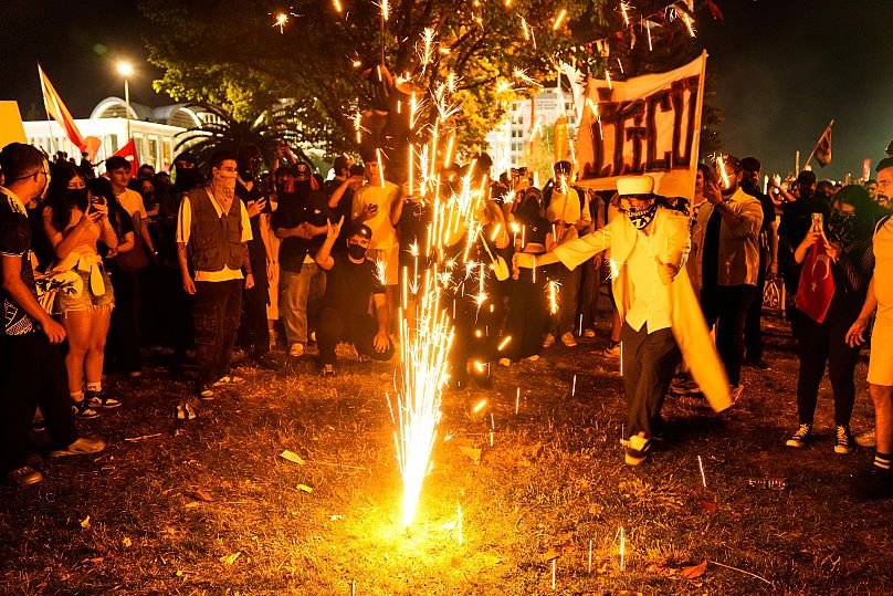 People light flares during a protest called by main opposition Republican People's Party outside the City Hall in Istanbul, 1 July, 2025