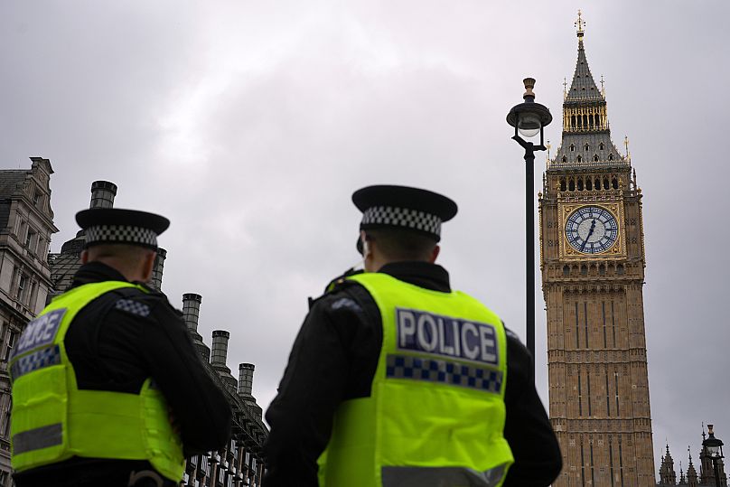 FILE: Police officers wait at Parliament Square for a protest by the Stop Trump Coalition group against President Donald Trump's state visit to London, 17 September 2025