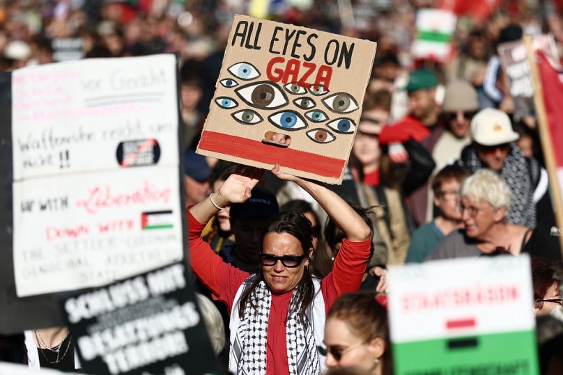 People protest against Israel during a mass demonstration called "All Eyes on Gaza" in support of Palestinians in Berlin, Germany, Saturday, Sept. 27, 2025. (AP Photo/Christop