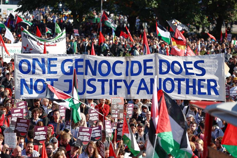 People protest against Israel during a mass demonstration called "All Eyes on Gaza" in support of Palestinians in Berlin, Germany, Saturday, Sept. 27, 2025. (AP Photo/Christop