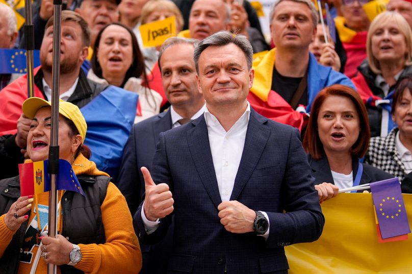 PM Dorin Recean flashes a thumbs up next to supporters during a pro-EU rally of the ruling PAS party ahead of Sunday's parliamentary vote, Chisinau, Moldova, Sept. 26, 2025