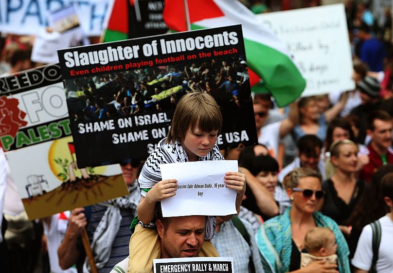 People take part in a protest march in Dublin to call for an end to Israeli military action in Gaza and justice and freedom for Palestine, 19 July, 2014